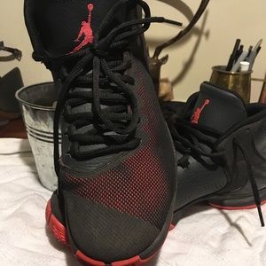 Black and coral Jordan's